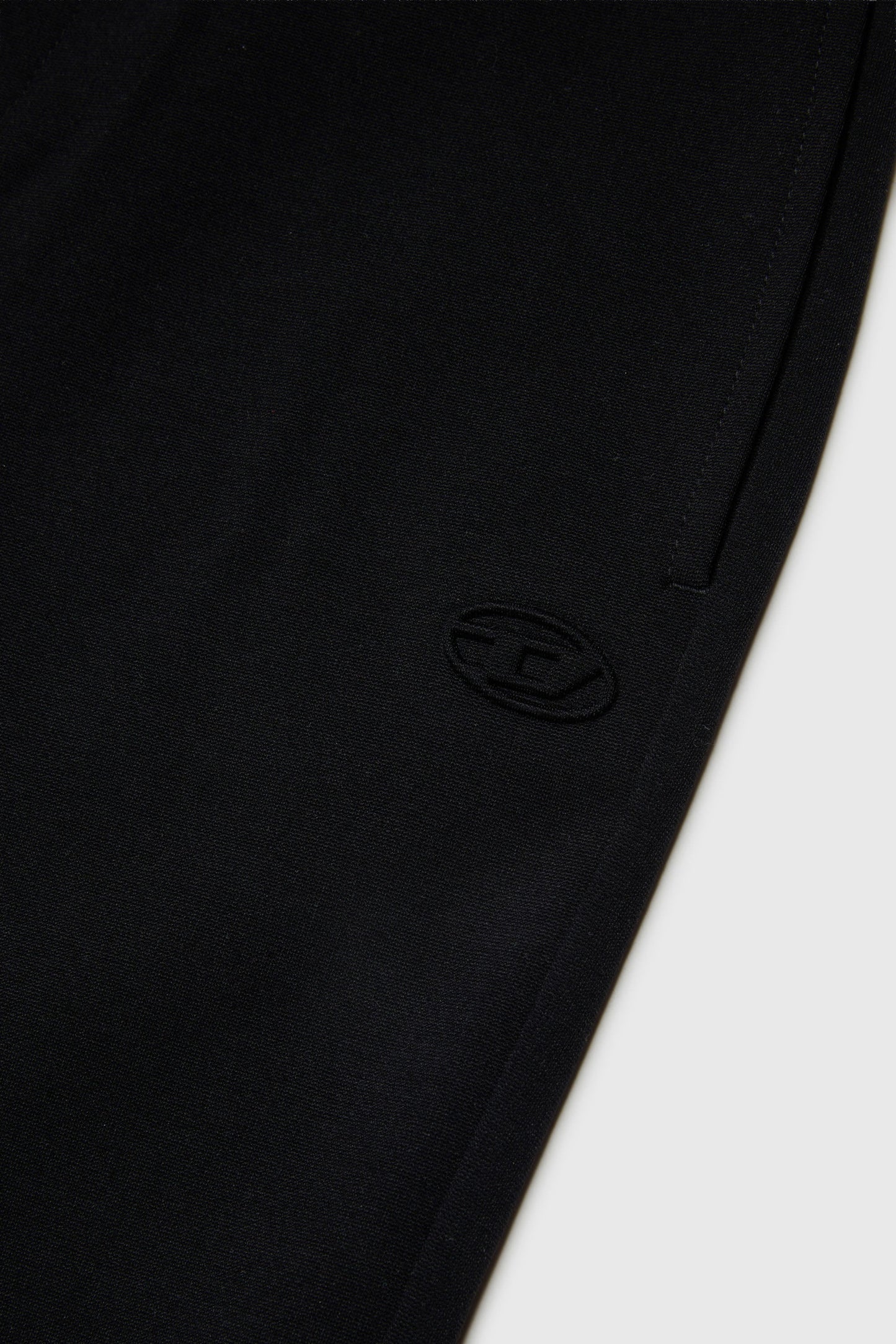 Flared pants in compact stretch fabric