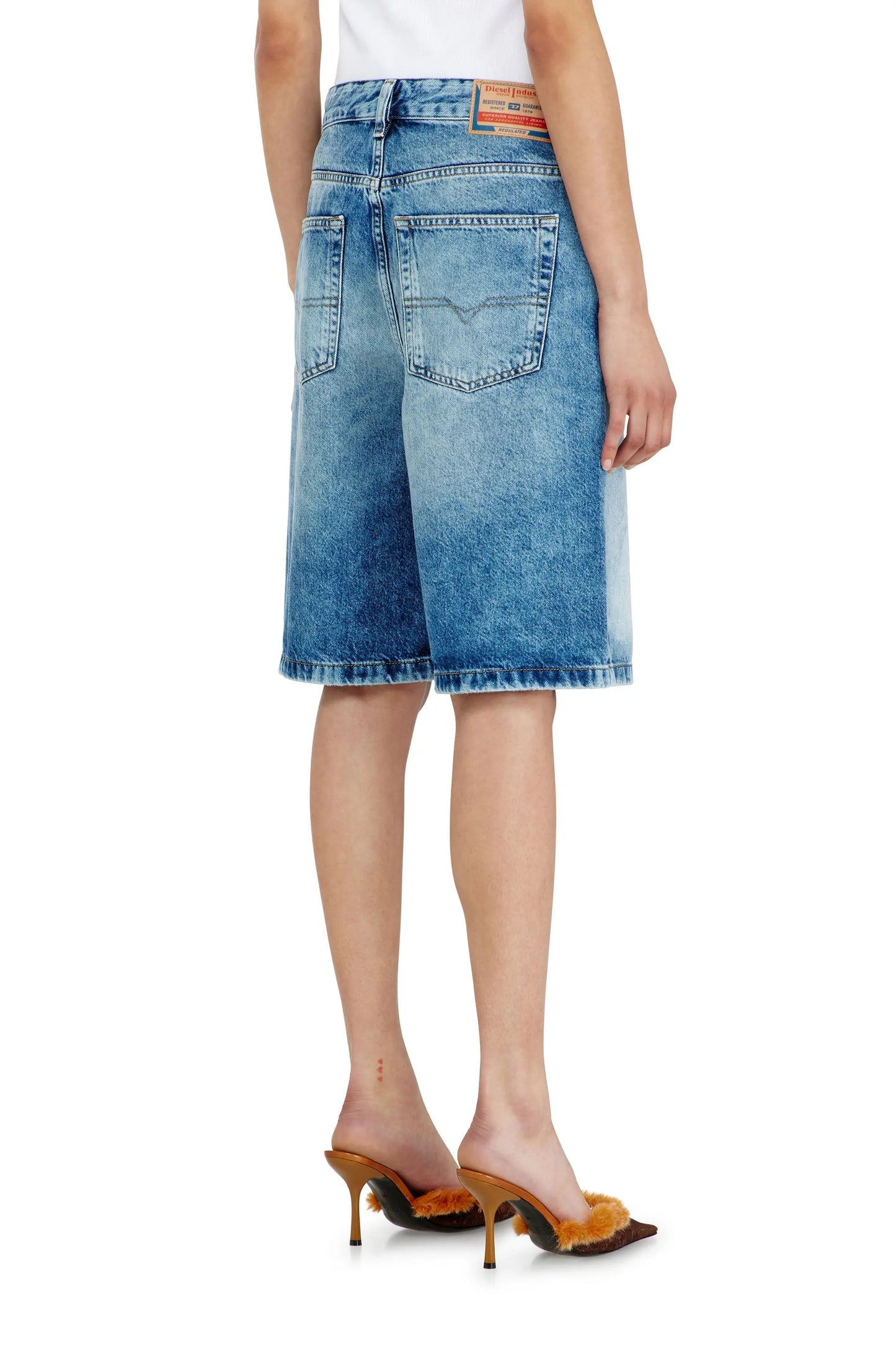 Relaxed shorts in fluid denim with abrasions