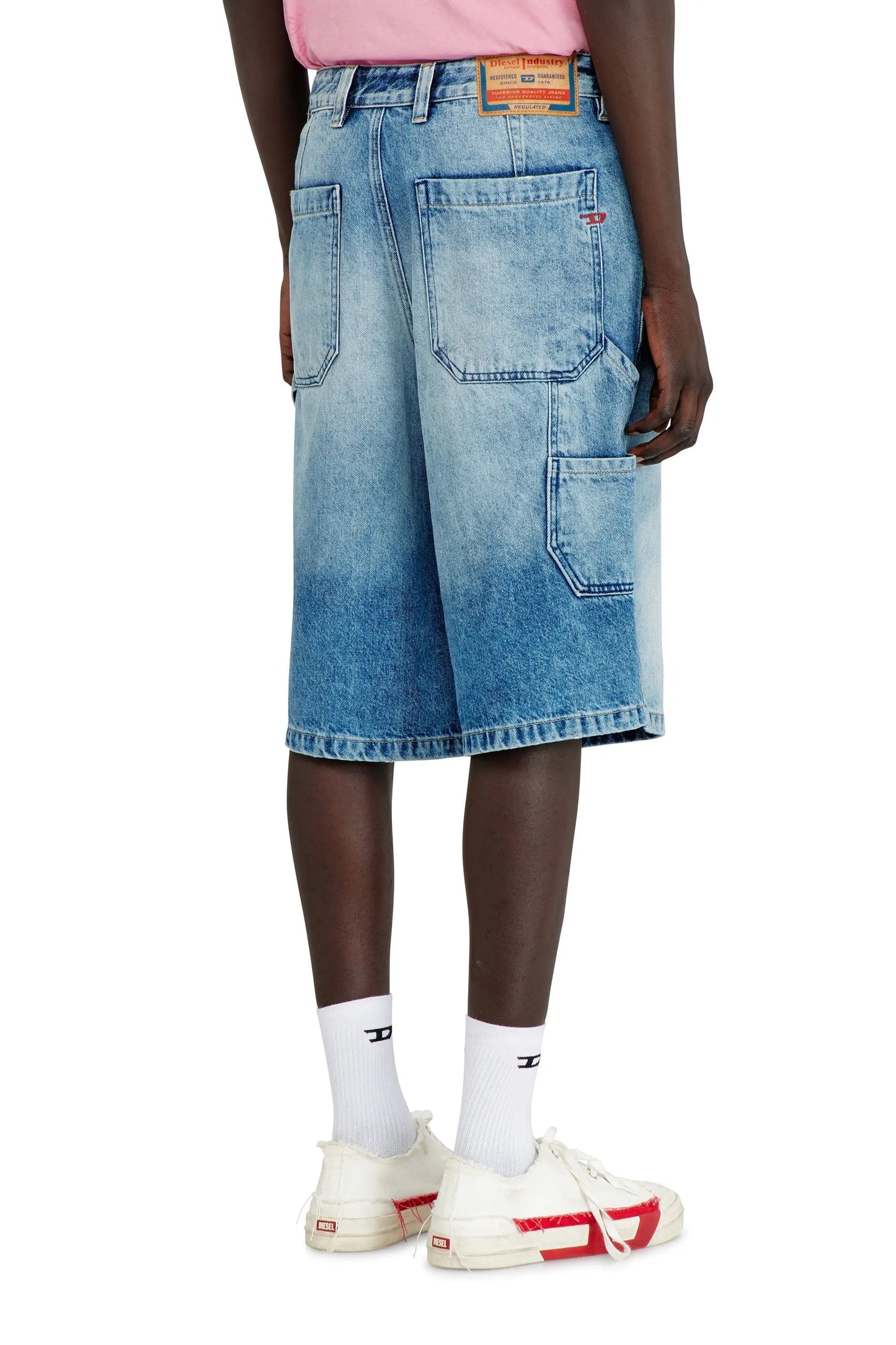 Relaxed shorts in fluid denim with abrasions