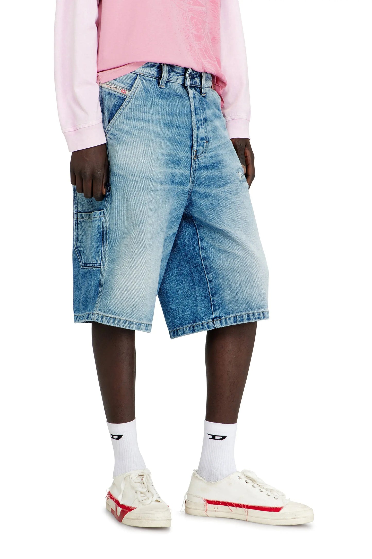Relaxed shorts in fluid denim with abrasions