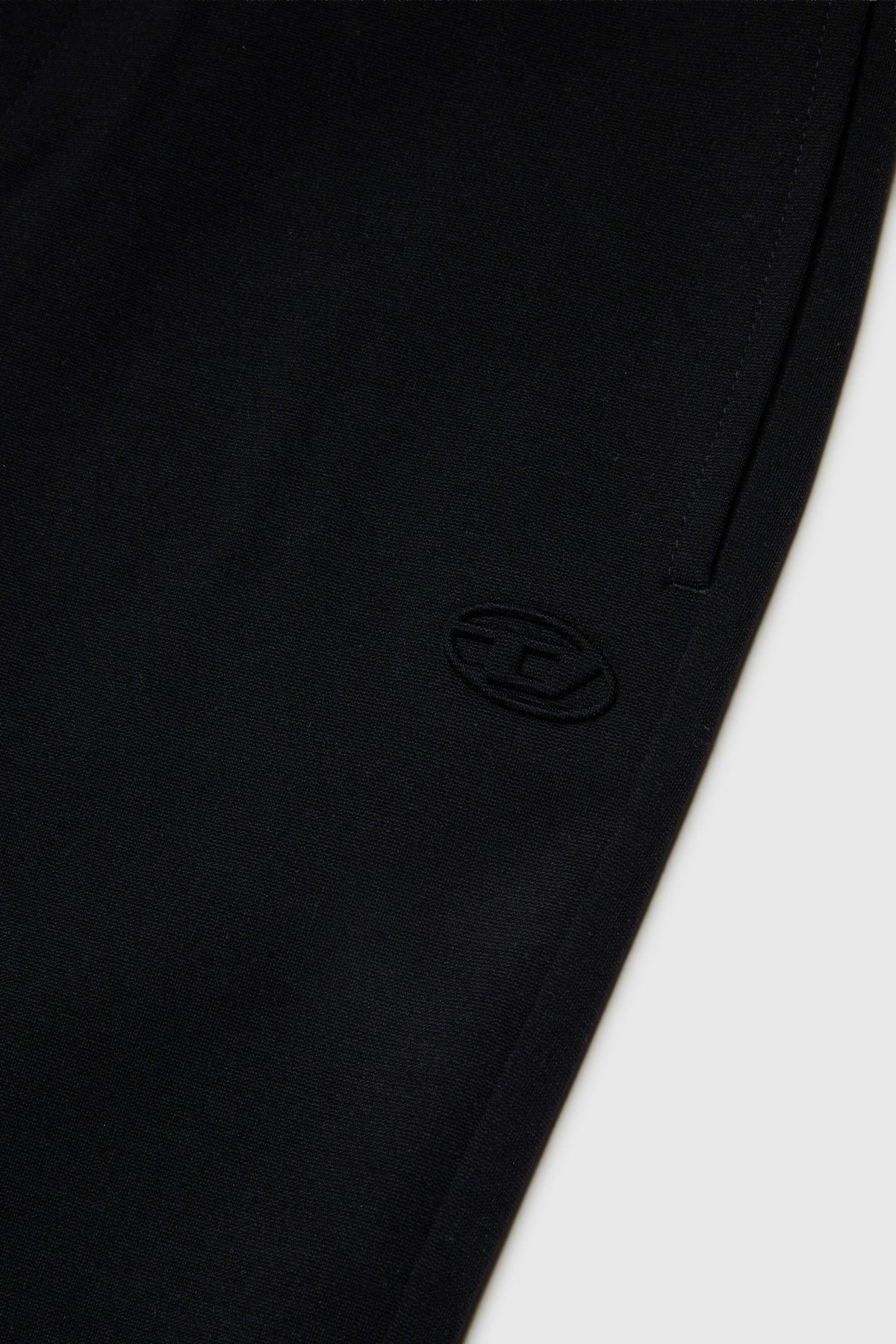 Flared pants in compact stretch fabric